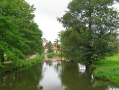 Caroline is walking by the river