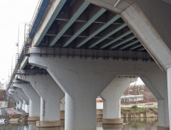 On a truck under the bridge