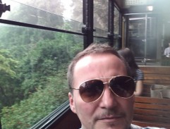 Frank Dux riding on the Peak Tram