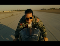 On a motorcycle by the runway